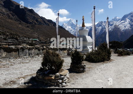 A prayer flag in the village of Khumjung on the everest base camp trek with Ama Dablam beyond Stock Photo