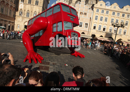 London Booster by Czech visual artist David Cerny does push ups on Old Town square in Prague. Stock Photo