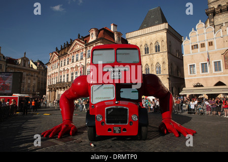 London Booster by Czech visual artist David Cerny does push ups on Old Town square in Prague. Stock Photo