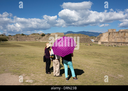 Monte Alban. A group of tourists visit the main square of the archaeological site. Stock Photo