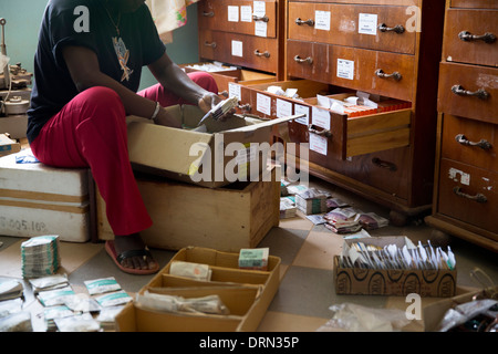 sorting donated glasses and lenses in eye clinic, Ouagadougou, Burkina Faso Stock Photo