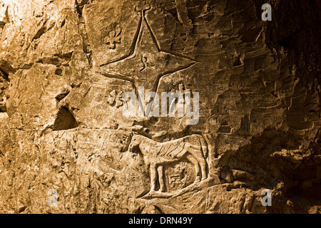 Carvings on walls of caves of Taittinger Champagne in Reims, Champagne-Ardenne, France Stock Photo