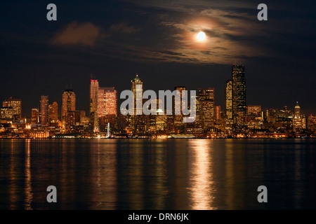 WASHINGTON - Moon over downtown Seattle and Elliott Bay from West Seattle. 2013 Stock Photo