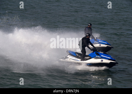 Alameda County police officers on jet skis patrolling during America's Cup race in the San Francisco Bay, California, USA Stock Photo