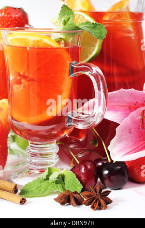 Refreshing fruit sangria in jug with different fruits solated on white Stock Photo