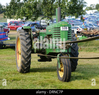 John Deere Model A tractor on belt drive at Bedford steam rally Stock Photo