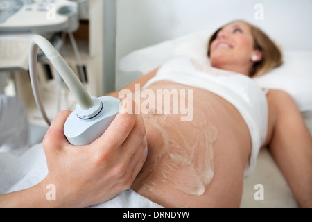 Pregnant Woman Going Through An Ultrasound Scan Stock Photo