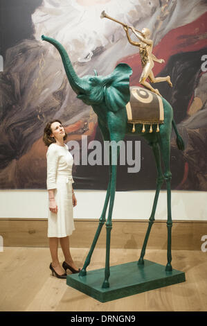 London, UK - 30 January 2014: a staff member poses next to ‘Elephant de Triomphe’ by Salvador Dalì (est £250.000-350.000) that will go on sale on the 4th February at Bonhams. Credit:  Piero Cruciatti/Alamy Live News Stock Photo