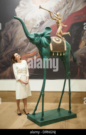 London, UK - 30 January 2014: a staff member poses next to ‘Elephant de Triomphe’ by Salvador Dalì (est £250.000-350.000) that will go on sale on the 4th February at Bonhams. Credit:  Piero Cruciatti/Alamy Live News Stock Photo