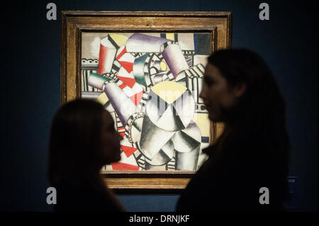 London, UK - 30 January 2014: staff members pose next to ‘Les Cylindres colorés’ by Fernand Léger (est £5-7 million) that will go on sale on the 4th February at Christie’s Credit:  Piero Cruciatti/Alamy Live News Stock Photo