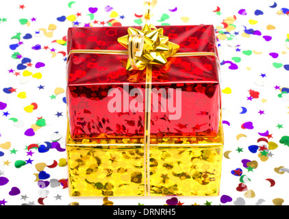 Red and golden gift box on the celebratory isolated background Stock Photo