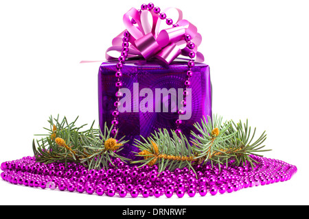 Violet gift with an ornament and a fur-tree on the white isolated background Stock Photo