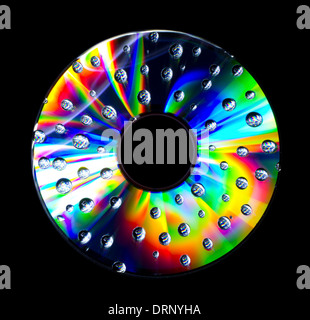 Abstract disc with water droplets isolated on black background Stock Photo