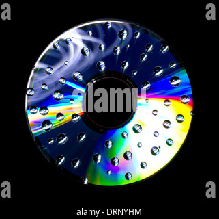 Abstract disc with water droplets isolated on black background Stock Photo