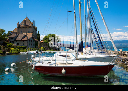 Yachts by the 12th Century medieval castle in the old port of Yvoire on Lac Leman, Lake Geneva, France