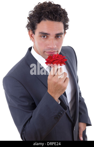 handsome man in suit seduces with rose Stock Photo