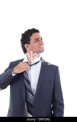 exhausted businessman in suit removing tie Stock Photo