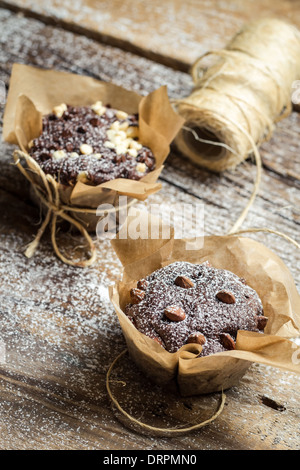 Closeup of decorating chocolate muffins with string Stock Photo - Alamy