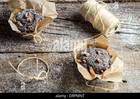 Sweet muffins wrapping with string Stock Photo - Alamy