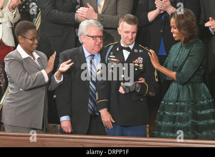 the USA. Capitol Washington DC, USA. 28th Jan, 2014. United States Army Sergeant 1st Class Cory Remsburg (2nd R) acknowledges the applause as he stands next to Sabrina Simone Jenkins (L), Craig Remsburg (2nd L) and first lady Michelle Obama (R) during U.S. President Barack Obama's State of the Union Address to a Joint Session of Congress in the U.S. Capitol Washington DC, USA, 28 January 2014. Credit: Ron Sachs / CNP. © dpa/Alamy Live News Stock Photo