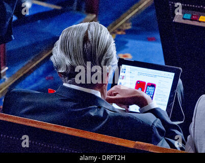 United States Representative Charlie Rangel (Democrat of New York) does some on-line shopping prior to U.S. President Barack Obama's State of the Union Address to a Joint Session of Congress in the U.S. Capitol on Tuesday, January 28, 2014. Credit: Ron Sachs / CNP Stock Photo