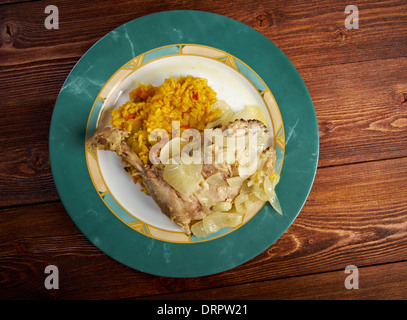 poulet yassa .roasted chickens .Yassa is a spicy marinated food prepared with poultry.Originally from Senegal, Stock Photo