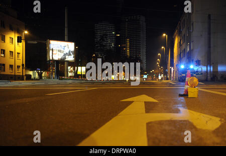Cologne, Germany. 30th Jan, 2014. A police car closes off a street in Cologne, Germany, 30 January 2014. A construction worker discovered an unexploded bomb from WWII at the Uni Center in Cologne. It will be exploded Thursday evening. Photo: CAROLINE SEIDEL/dpa/Alamy Live News Stock Photo