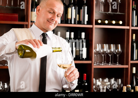 Waiter serve wine glass happy restaurant Stock Photo