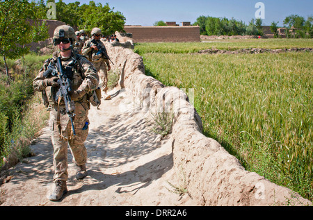 US Airmen with the 455th Air Expeditionary Wing, patrol a village around Bagram Airfield June 6, 2012 in Nowdeh, Parwan province, Afghanistan. Stock Photo