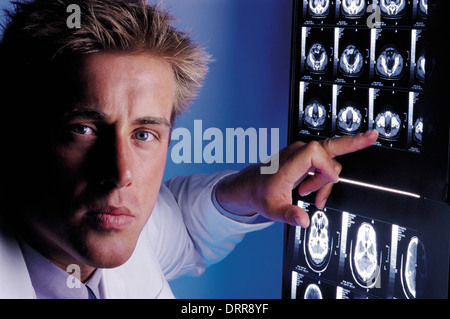 Doctor checking brain scans Stock Photo