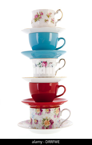 stacked vintage coffee or tea cups isolated over white background Stock Photo