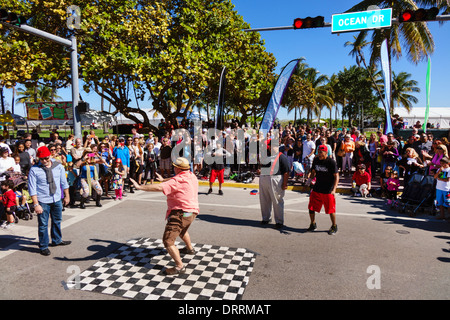 Miami Beach Florida,Ocean Drive,Art Deco Weekend,festival,street fair,event,performers,audience participation,crowd,watching,dancing,adult adults man Stock Photo