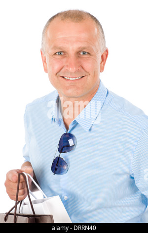 Mature smilling man hold shopping bags Stock Photo