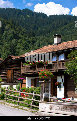 Typical Swiss wooden chalet style house in Serneus near Klosters in Graubunden region, Switzerland Stock Photo