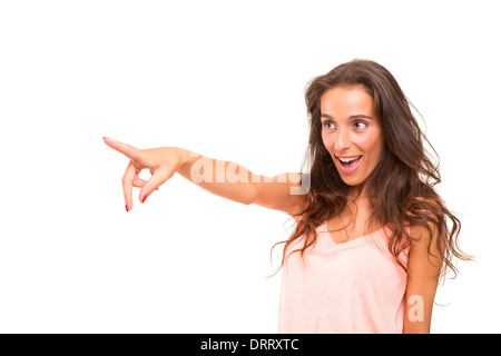 A beautiful woman pointing to something, isolated over a white background Stock Photo
