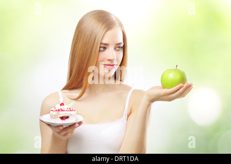 girl holding a cake and apple Stock Photo