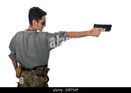 Man in camouflage with gun. Stock Photo