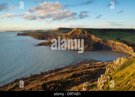 Fabulous late afternoon view across Chapman's Pool with the sun reflecting off the face of Houns-tout Cliff. Dorset, UK Stock Photo