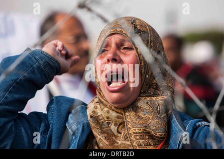 Cairo, Egypt. 1st Feb, 2014. A supporter shouts slogans outside the Police Academy in Cairo, Egypt, Feb. 1, 2014. Egypt's ousted president Mohamed Morsi arrived in Cairo for a trial on charges of inciting violence and killing protesters outside the presidential palace in late 2012, official news agency MENA reported on Saturday. Credit:  Cui Xinyu/Xinhua/Alamy Live News Stock Photo