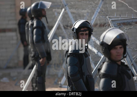 Cairo, Egypt. 1st Feb, 2014. Police stand guard outside the Police Academy in Cairo, Egypt, Feb. 1, 2014. Egypt's ousted president Mohamed Morsi arrived in Cairo for a trial on charges of inciting violence and killing protesters outside the presidential palace in late 2012, official news agency MENA reported on Saturday. Credit:  Cui Xinyu/Xinhua/Alamy Live News Stock Photo