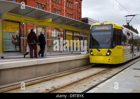 Oldham, Manchester, UK 1st February, 2014. Piccadilly Tram at Oldham Central station .  The Metrolink expansion continues with transport services now running into Oldham town centre, with four brand new stops being added to the Oldham Rochdale line. This 14 mile (22.5 km) extension to Oldham and Rochdale leaves the Bury Metrolink line just outside the city centre and runs along the abandoned railway corridor to Central Park in East Manchester. Here it joins the former Oldham loop rail line between Manchester, Oldham and Rochdale. Stock Photo