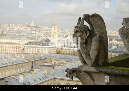 Gargoyle stryga on the western facade of the Notre-Dame Cathedral in fourth arrondissement, Paris. France. Stock Photo