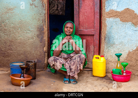 Woman Selling Alcohol At The Saturday Market In Jinka, Omo Valley, Ethiopia Stock Photo