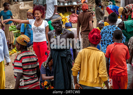 A Man From The Mursi Tribe Walks Through The Market In Jinka, Omo Valley, Ethiopia Stock Photo