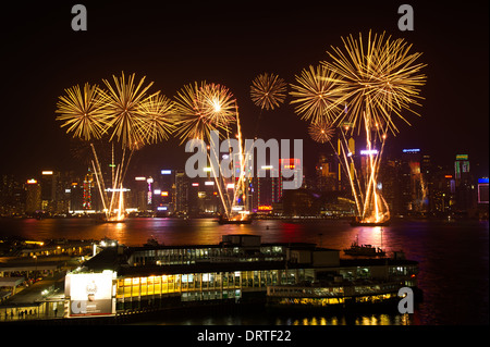 Firework explode over Victoria Harbour in Hong Kong on February 1, 2014 as China Celebrates the year of the Horse. Stock Photo