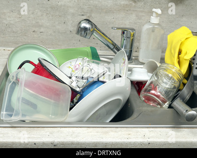 Kitchen sink full of dirty kitchenware Stock Photo