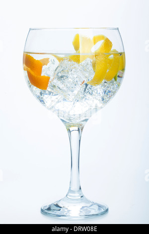 orange lemon and lime gin tonic isolated over white background Stock Photo