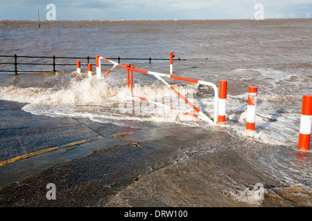 A very high Spring tide at the slipway on Meols Parade near Hoylake on The Wirral Stock Photo