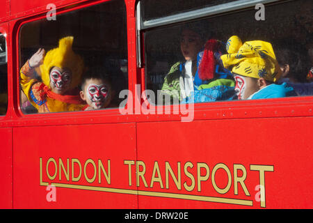 London, UK. 2 February 2014. Children from the Beijing Opera travelled the parade in a red double-decker Routemaster bus. Chinese New Year parade to welcome the Year of the Horse in Charing Cross Road and Shaftesbury Avenue, London. Credit:  Nick Savage/Alamy Live News Stock Photo