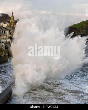 Gigantic waves crash into the seaside town of Ilfracombe at high tide, Devon as the UK embraces stormy weather. Credit:  guy harrop/Alamy Live News Stock Photo